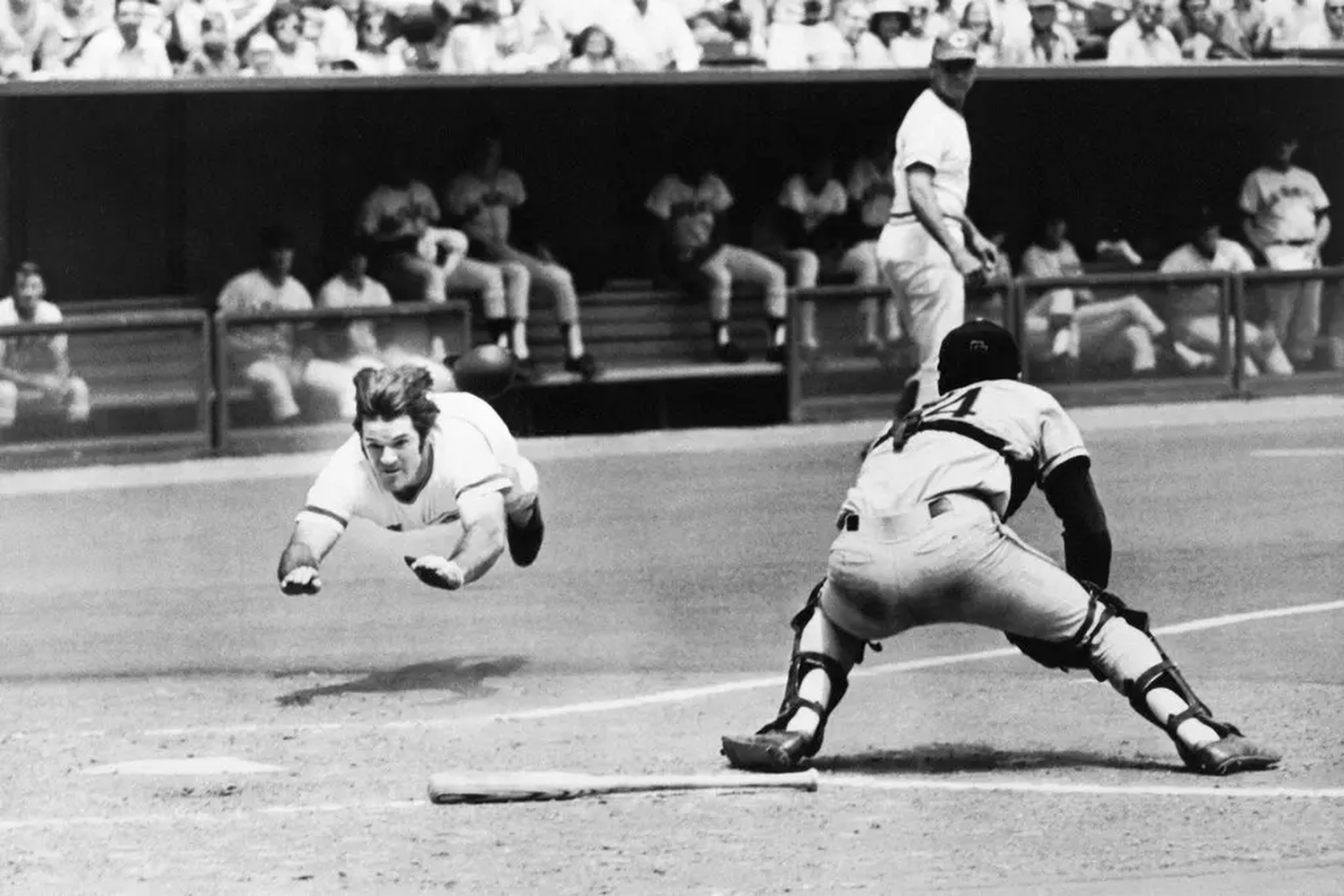 Pete Rose slides into home during a Reds game against the Giants in 1972.