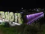 El Murallón del Dique se ilumina de rosa para concientizar sobre el cáncer de mama
