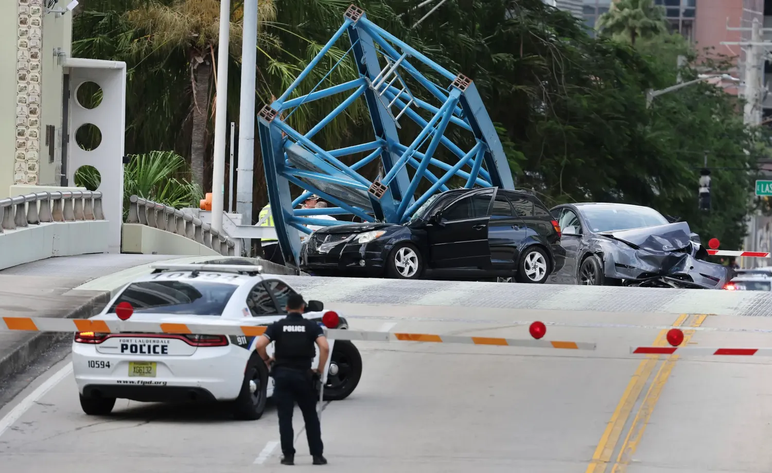 A construction worker is dead, and two others are injured after a piece of a construction crane plummeted down on a busy bridge in Fort Lauderdale, Florida.