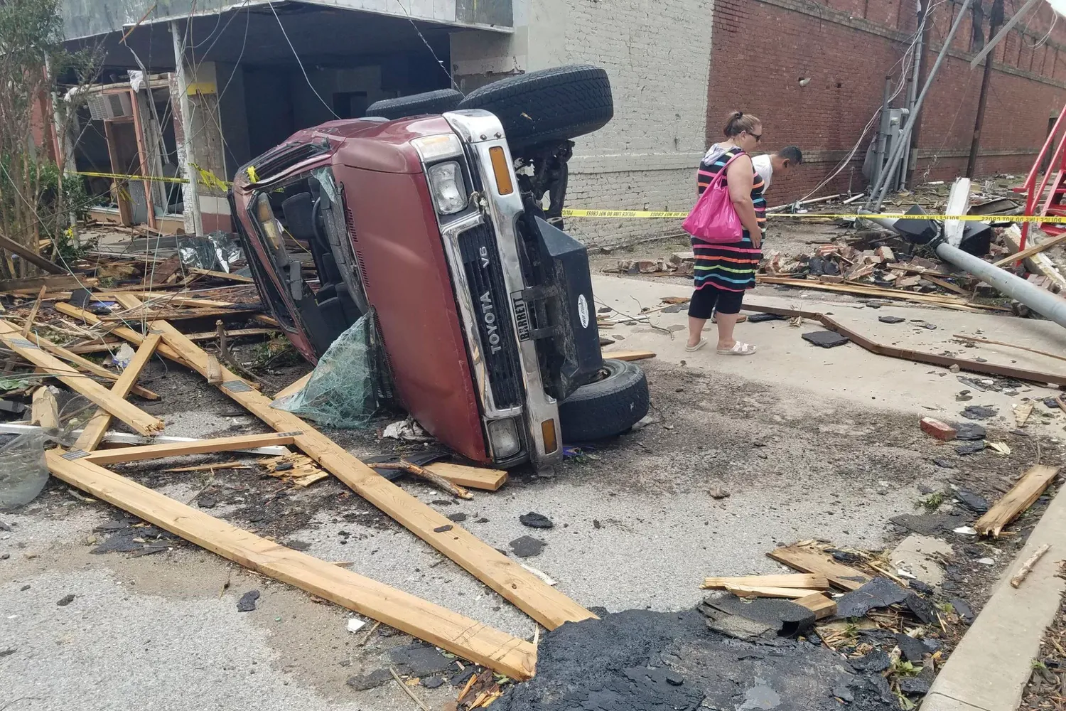 A car lies on its side in Sulphur, Oklahoma.