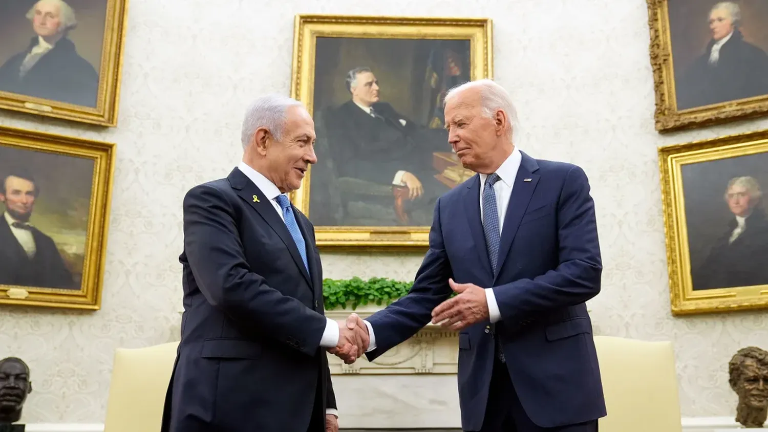 President Joe Biden, right, shakes hands with Israeli Prime Minister Benjamin Netanyahu, left, in the Oval Office of the White House in Washington, DC, on Thursday, July 25.