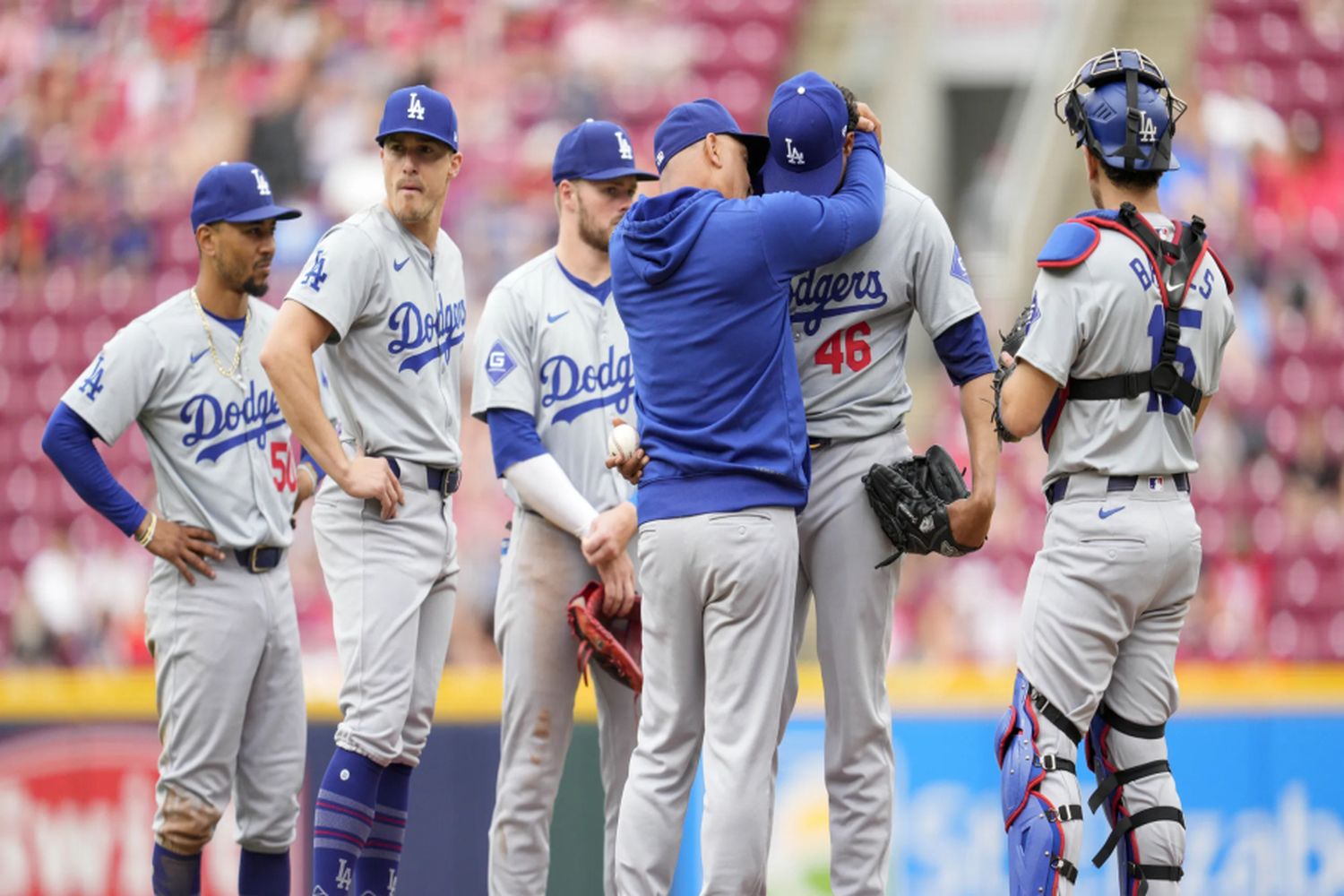 Manager Dave Roberts consoles Dodgers players as they navigate their toughest losing streak in five years.