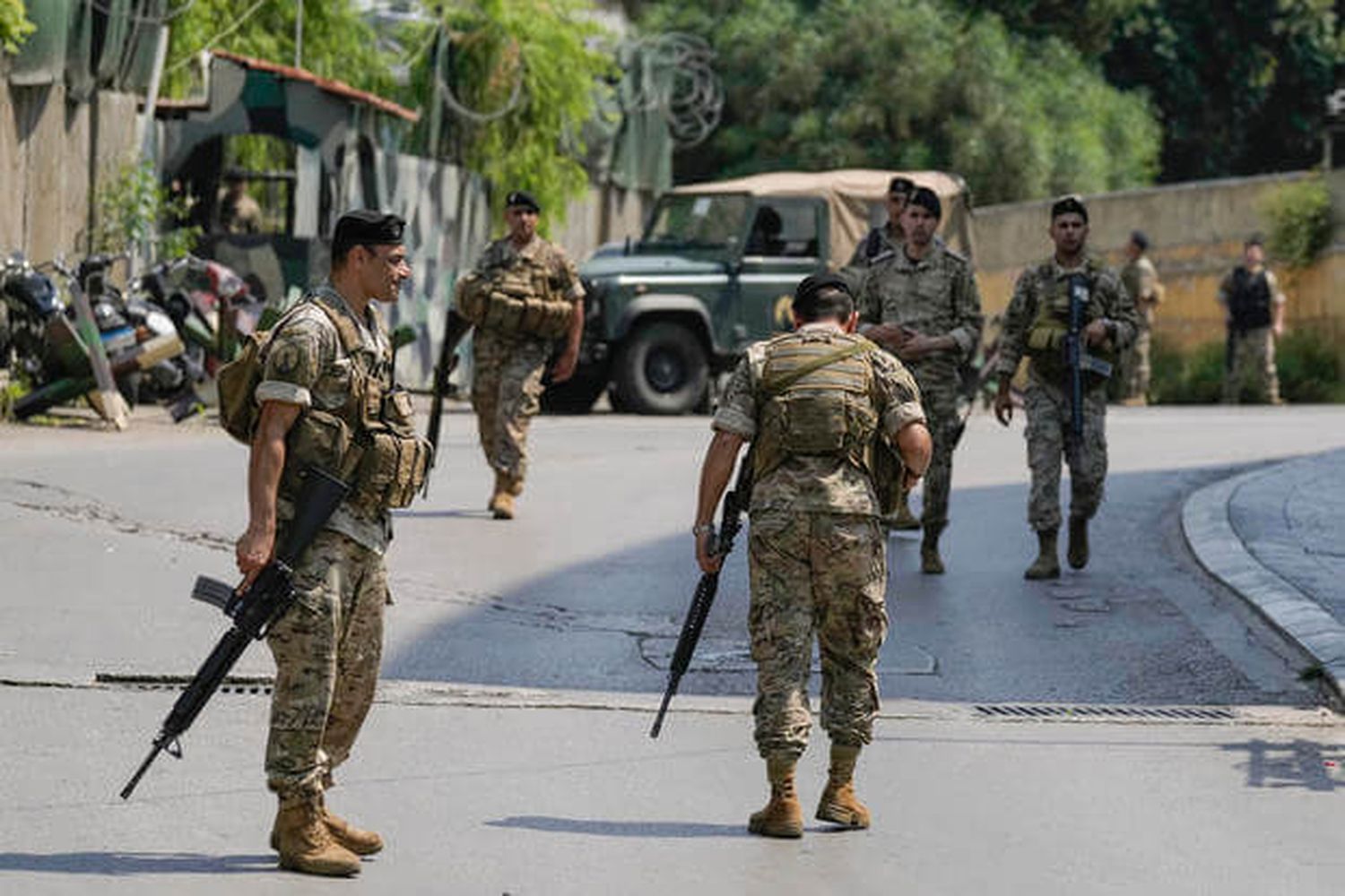 Lebanese security stand guard on a road that leads to the U.S. Embassy in Aukar, a northern suburb of Beirut, Lebanon, Wednesday, June 5, 2024.