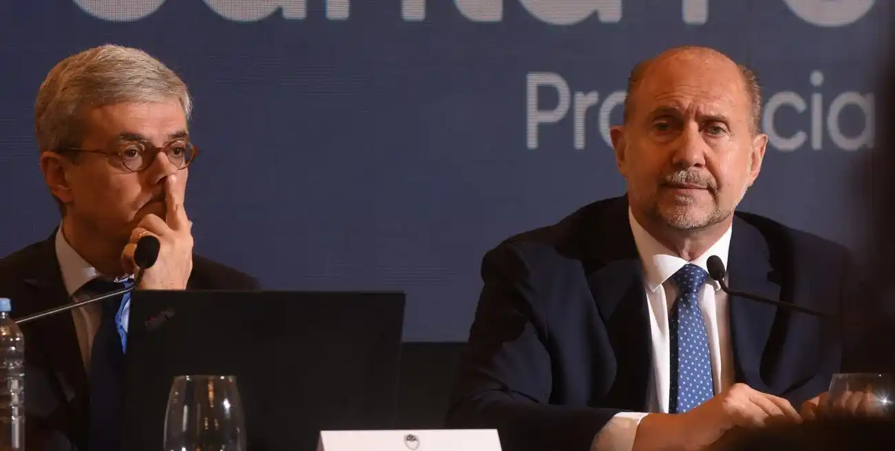 Walter Agosto, ministro de Economía, y el gobernador Omar Perotti. Crédito: Mauricio Garín.