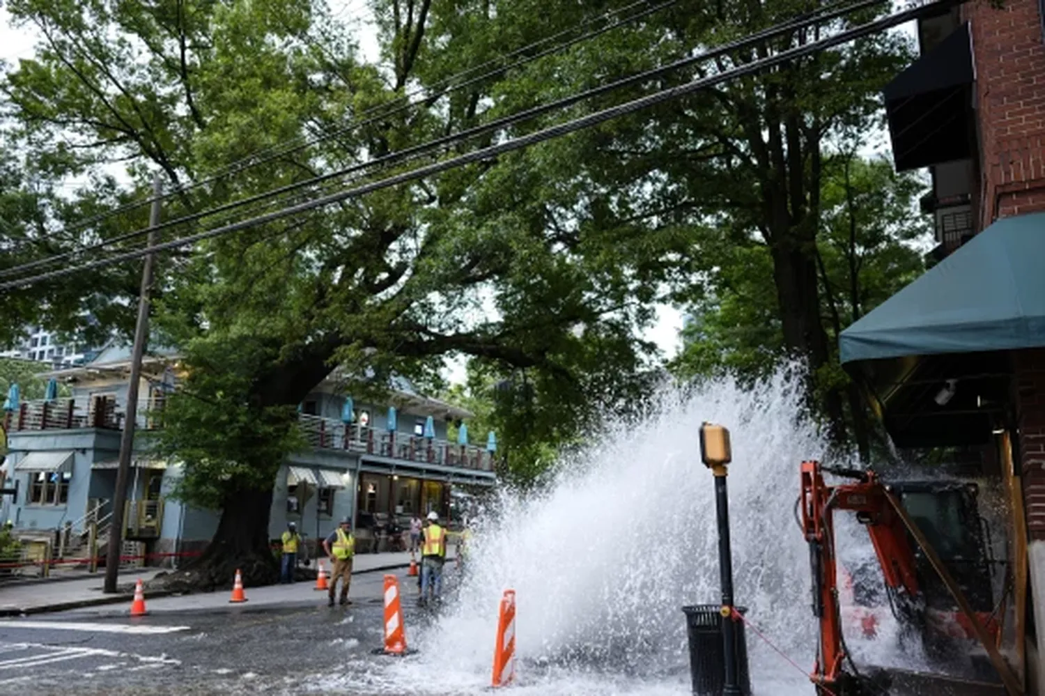 Water gushes out of a broken water transmission line in downtown Atlanta on Saturday.