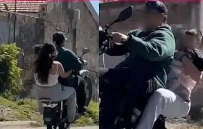 Una pareja circuló sin casco y levantó la moto en una rueda con un bebé a bordo