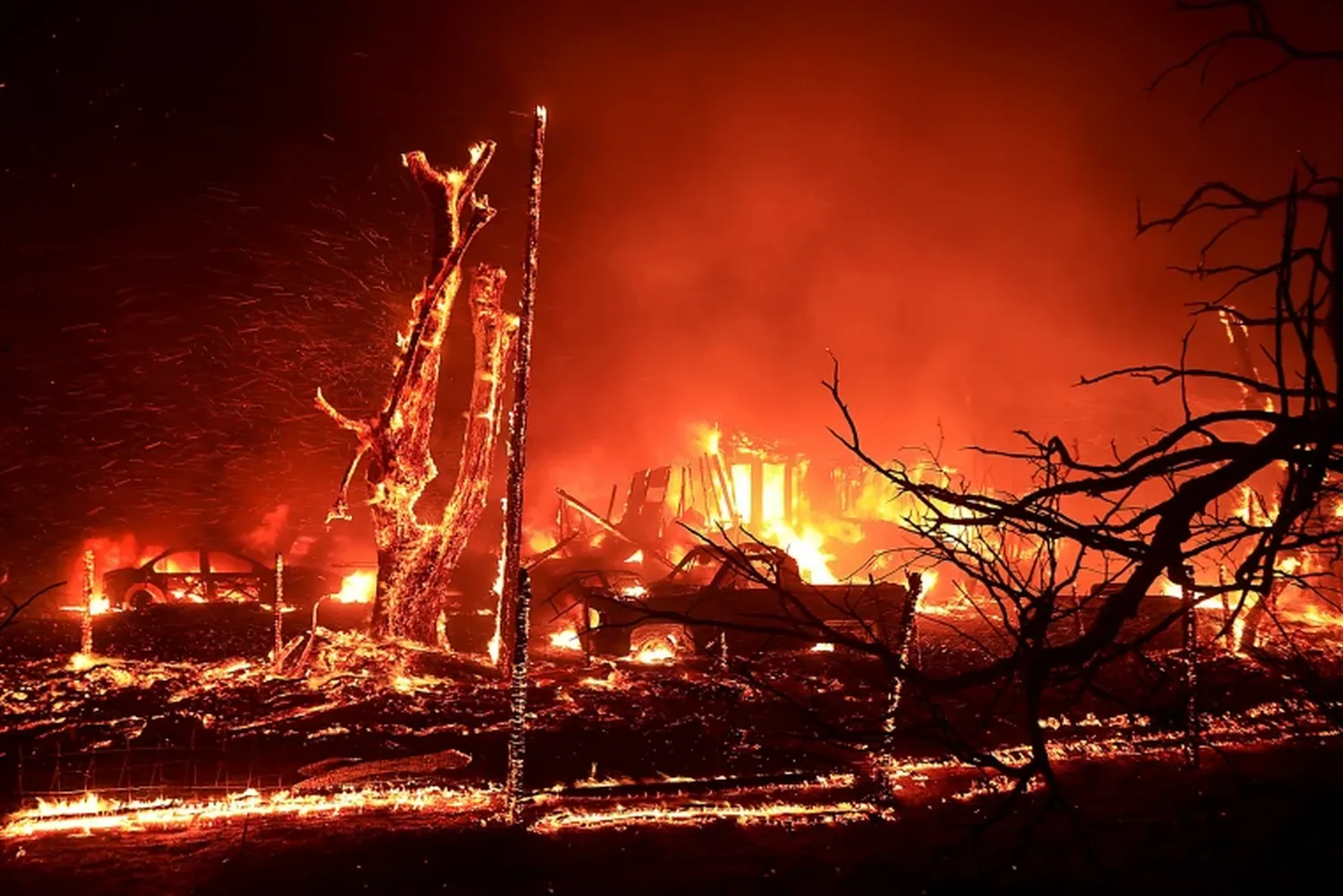 A home burns during the Corral Fire near Tracy, Calif., on Saturday.