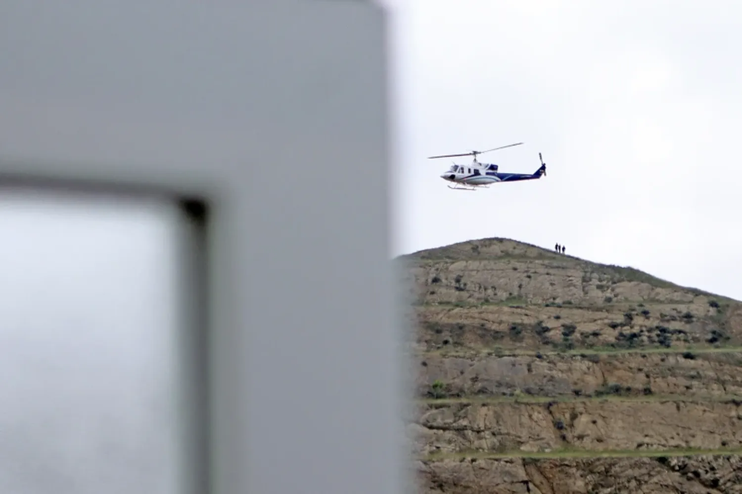 The helicopter carrying Iranian President Ebrahim Raisi takes off at the Iranian border with Azerbaijan after President Raisi and his Azeri counterpart Ilham Aliyev inaugurated the dam of Qiz Qalasi