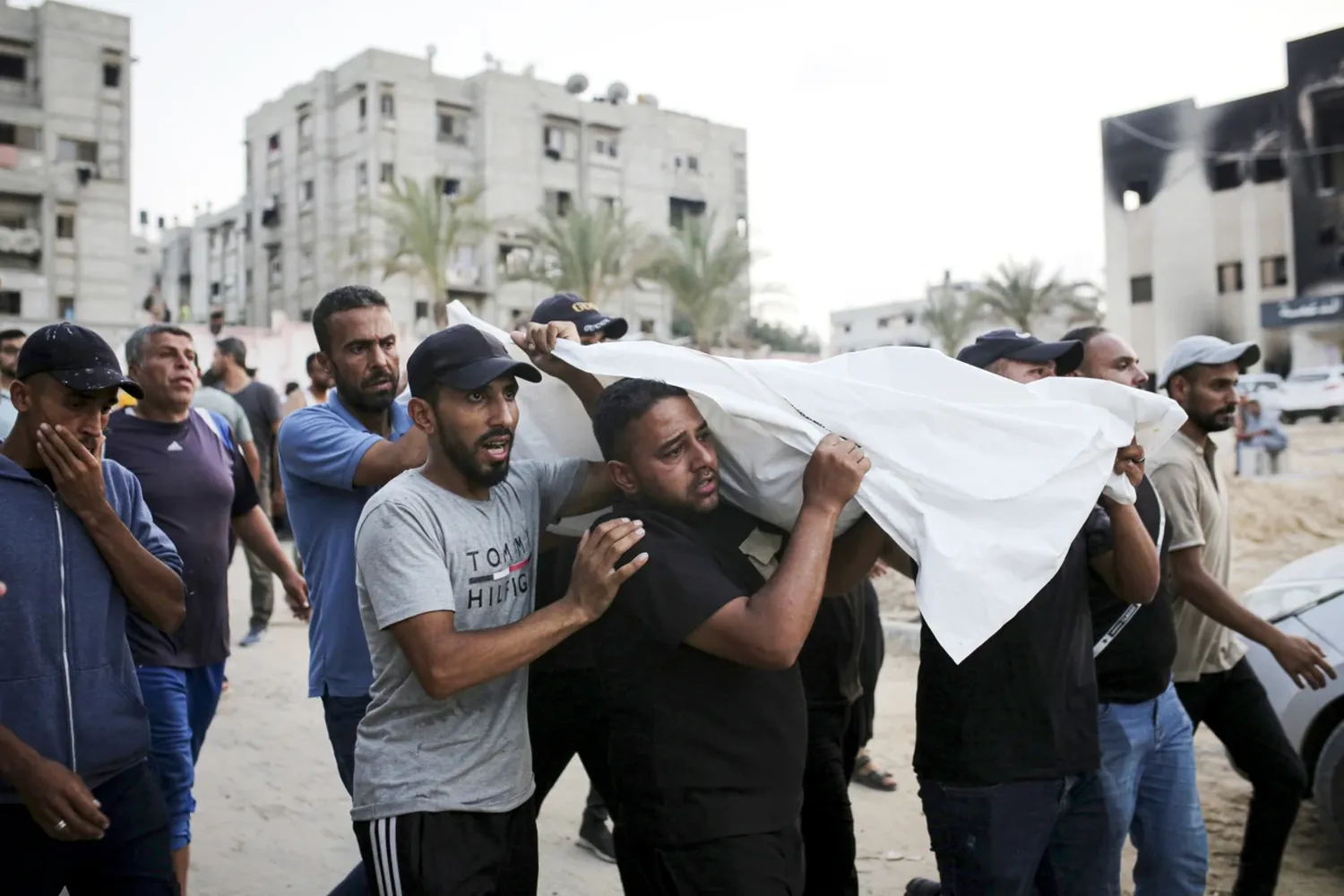 Palestinians carry a person killed by Israeli bombardment to their burial in Khan Younis, southern Gaza Strip on June 21