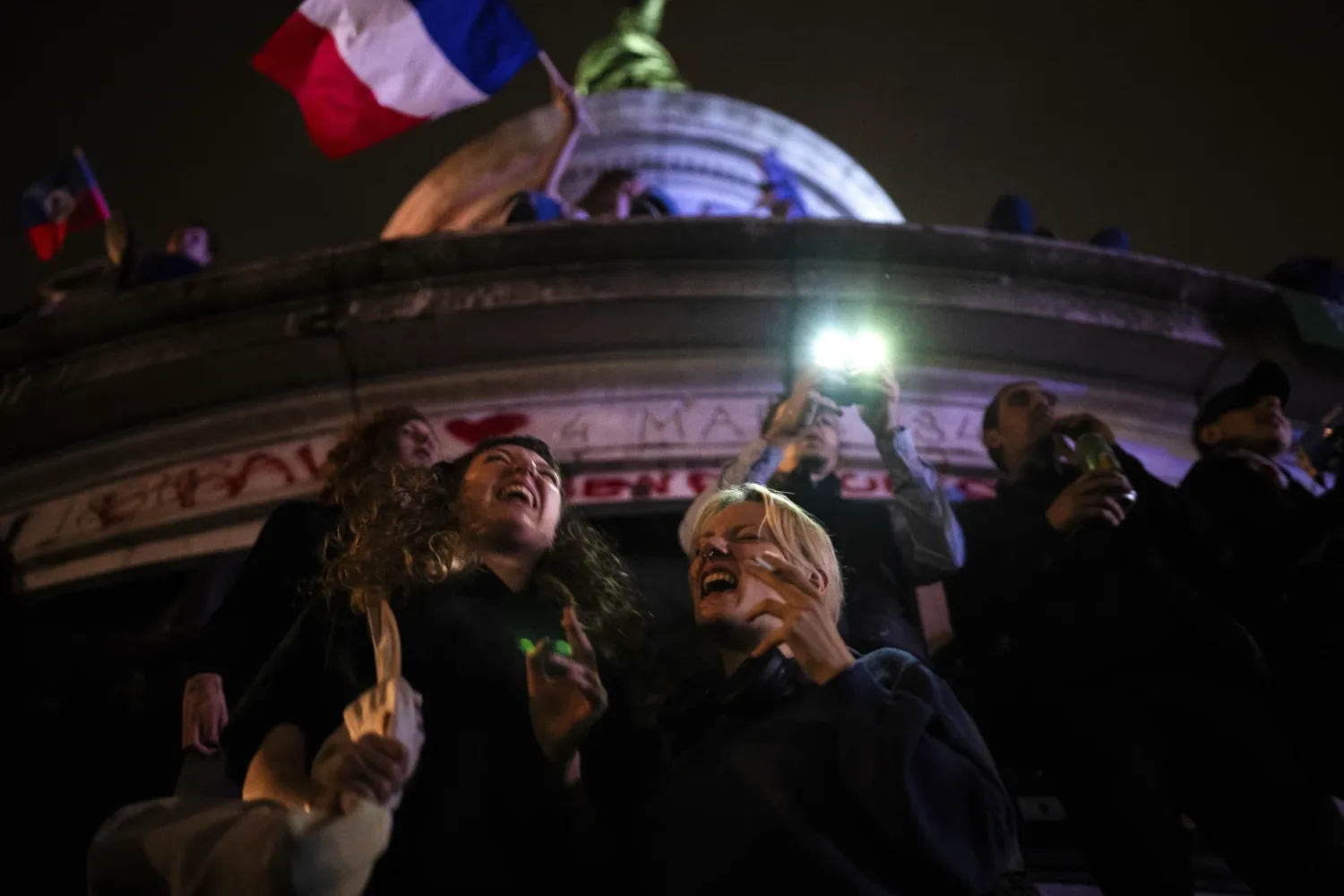 People gather at the Republique plaza after the second round of the legislative election, Sunday, July 7 2024.