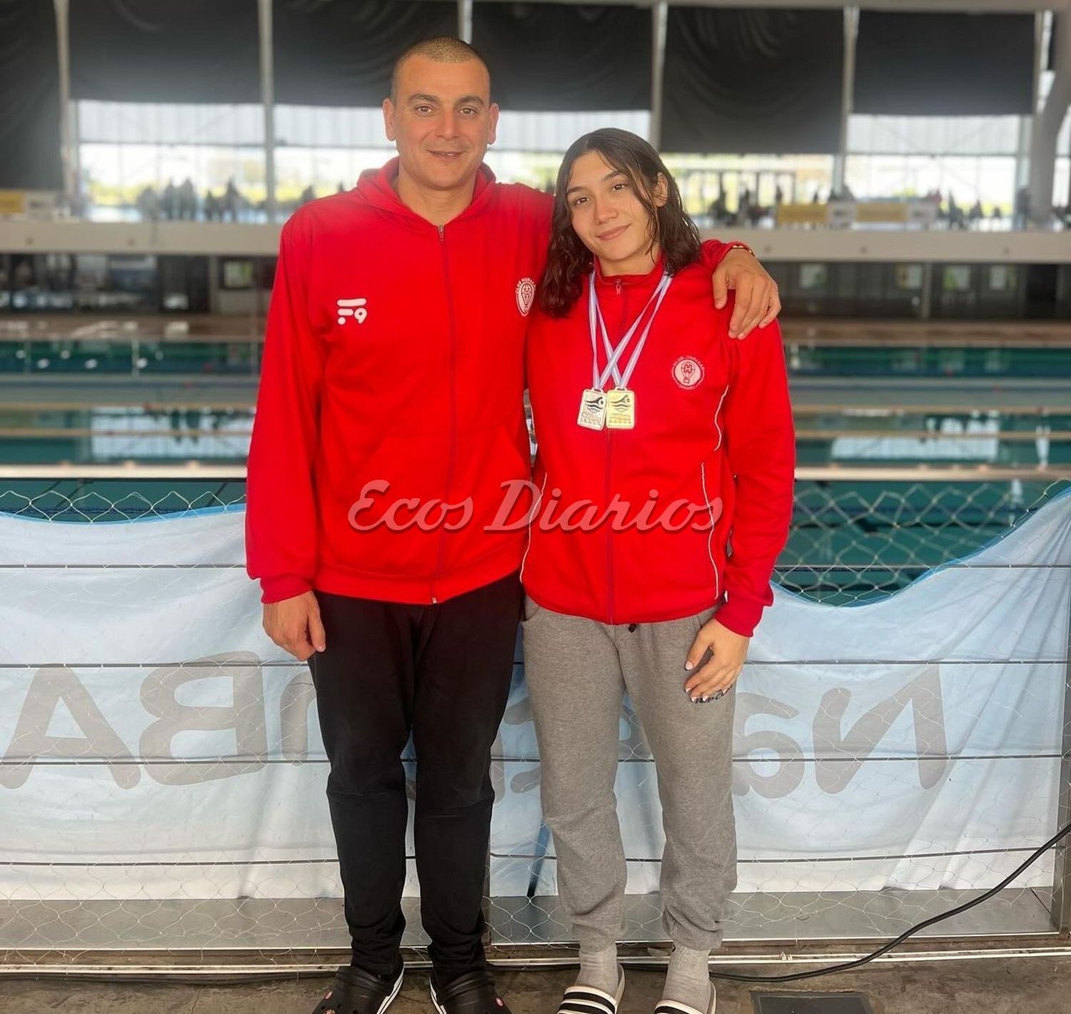 Guadalupe Angiolini junto a su entrenador, Claudio Castagnari