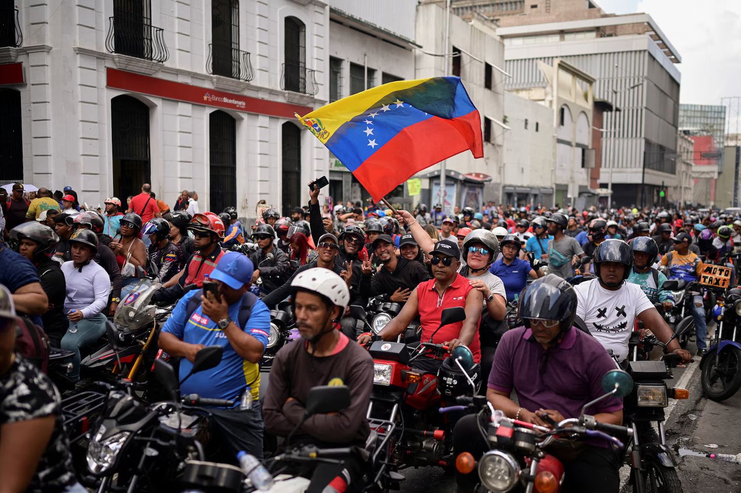 Motorized supporters of Venezuelan President Nicolas Maduro rally in favor of a proposed bill