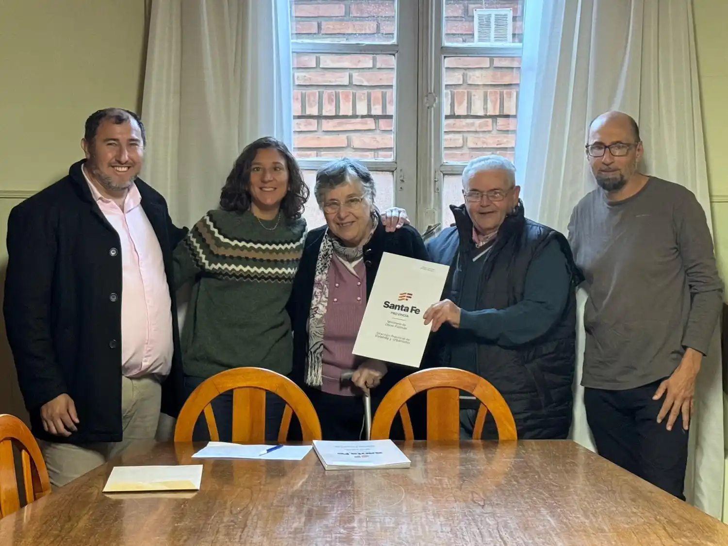 Una de las ocho familias que accedió a la escritura.