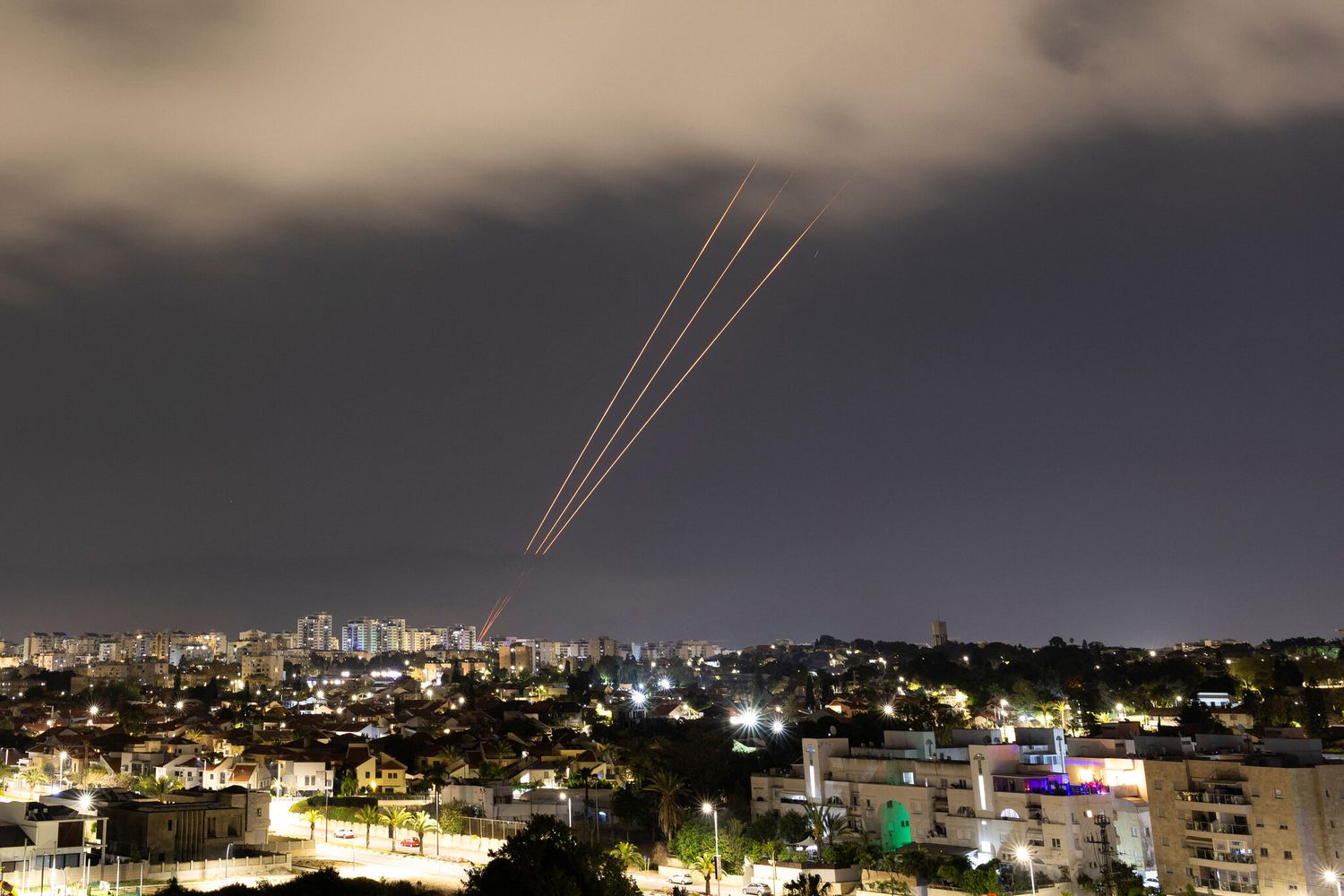 Air-raid sirens sounded across Israel and the West Bank as the night sky lit up with incoming missiles and interceptions.