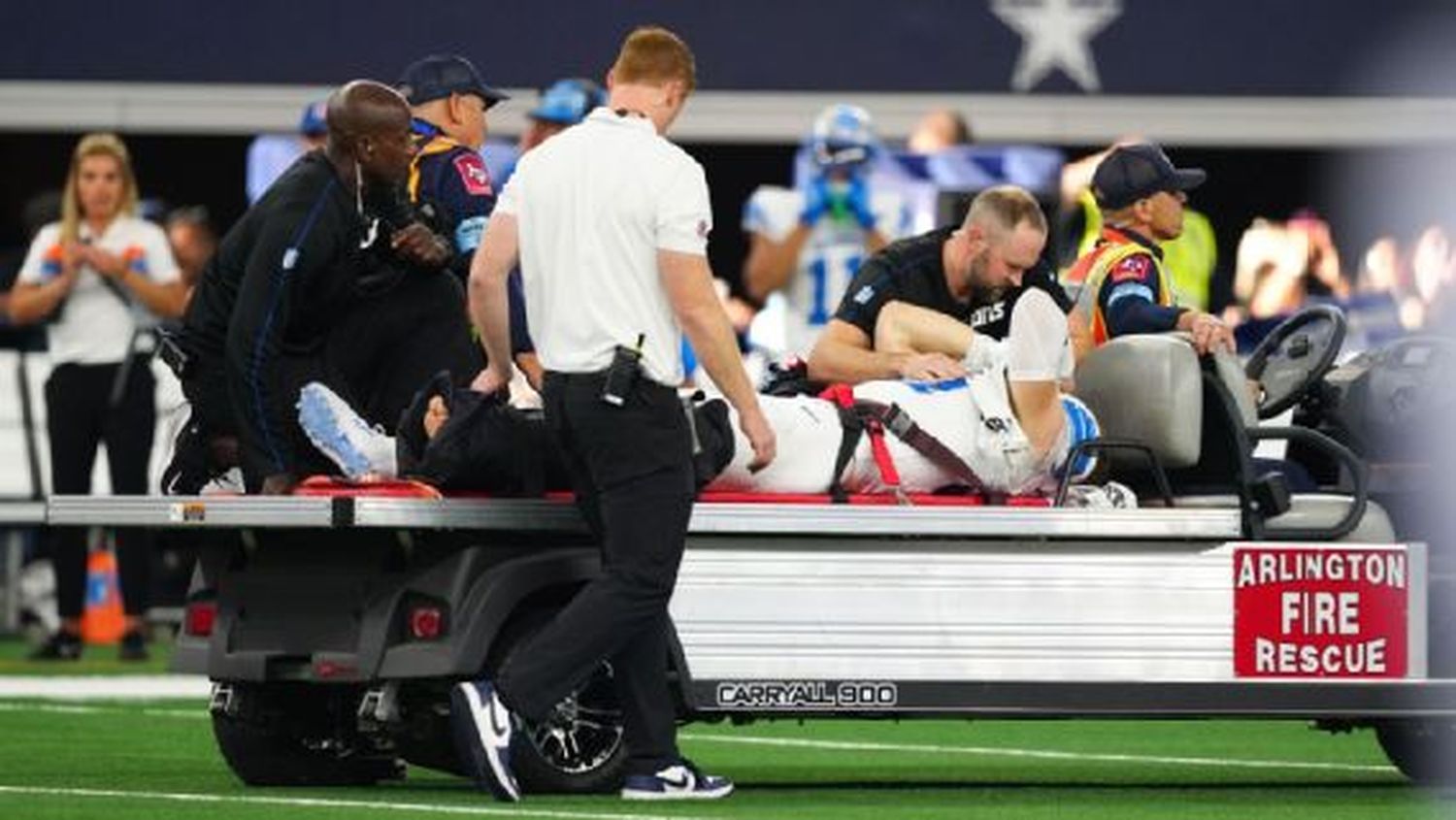 Lions defensive end Aidan Hutchinson was carted off the field Sunday after breaking a tibia.