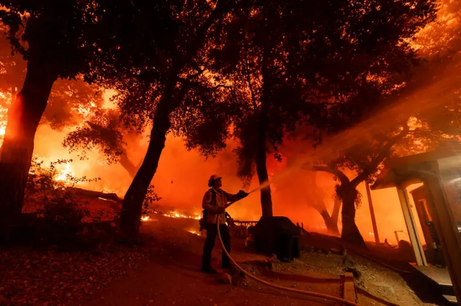 Airport Fire in Riverside, Orange counties slows but still threatens homes