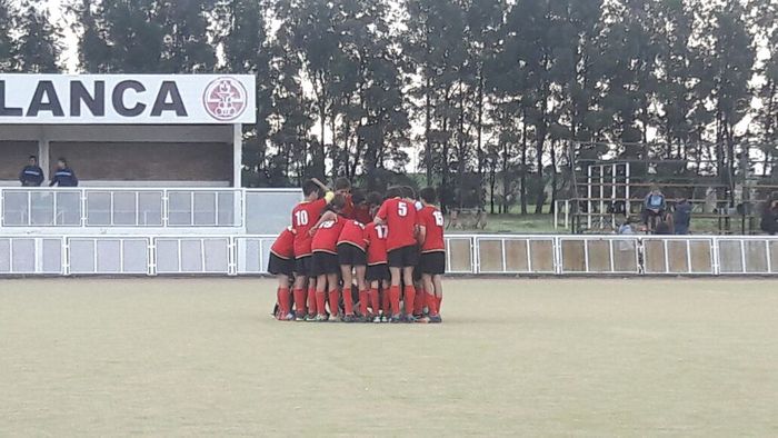 La arenga previa del equipo masculino.
