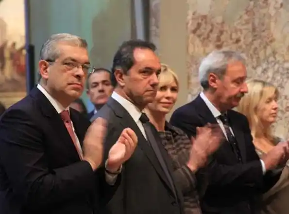 Scioli y Julián Domínguez, juntos en la misa en que ordenaron Arzobispo al rector de la UCA