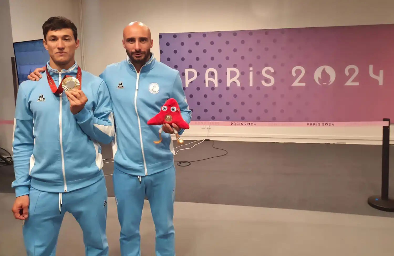 Vázquez, con su entrenador.