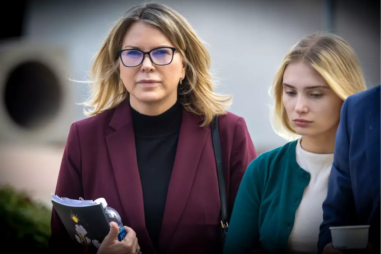 Rebecca Grossman, left, and her daughter, Alexis, walk into court in February.