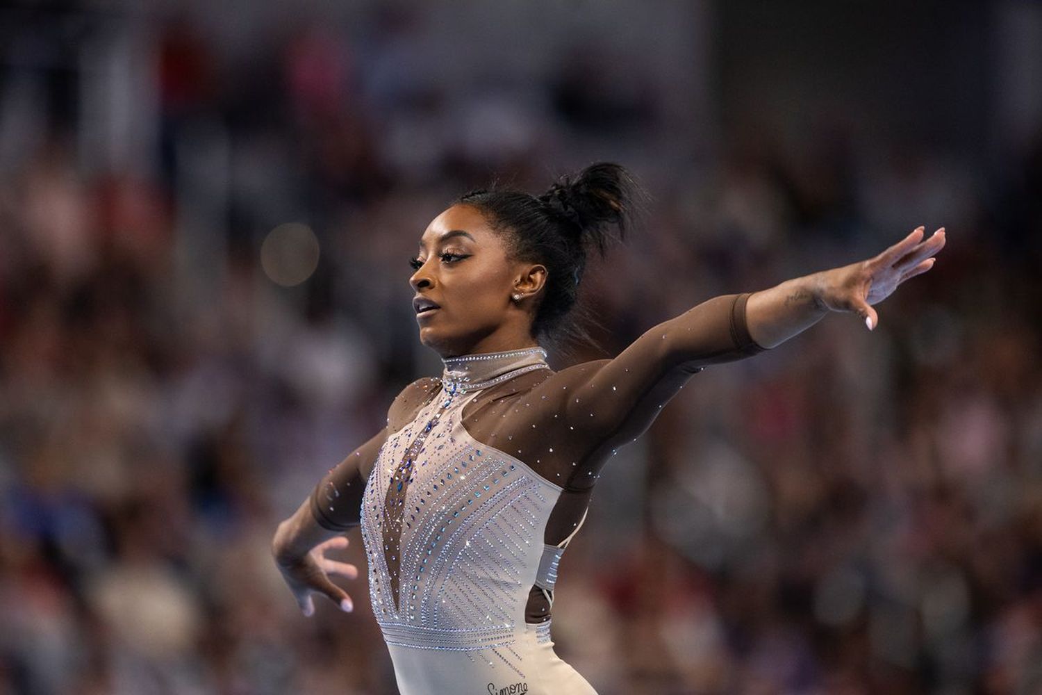 Simone Biles prepares for her third Olympic appearance amid past challenges and new triumphs.