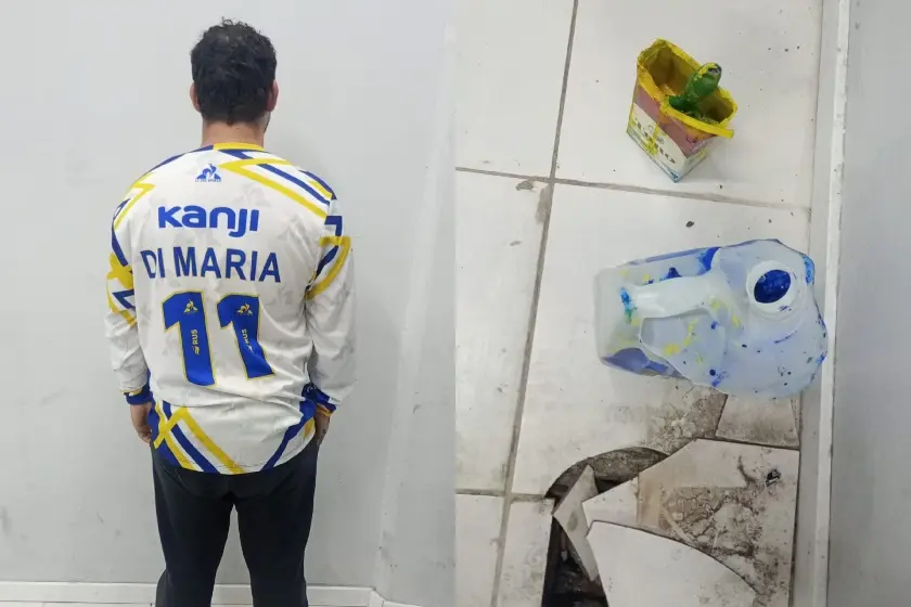 Detenido y elementos de pintura.
