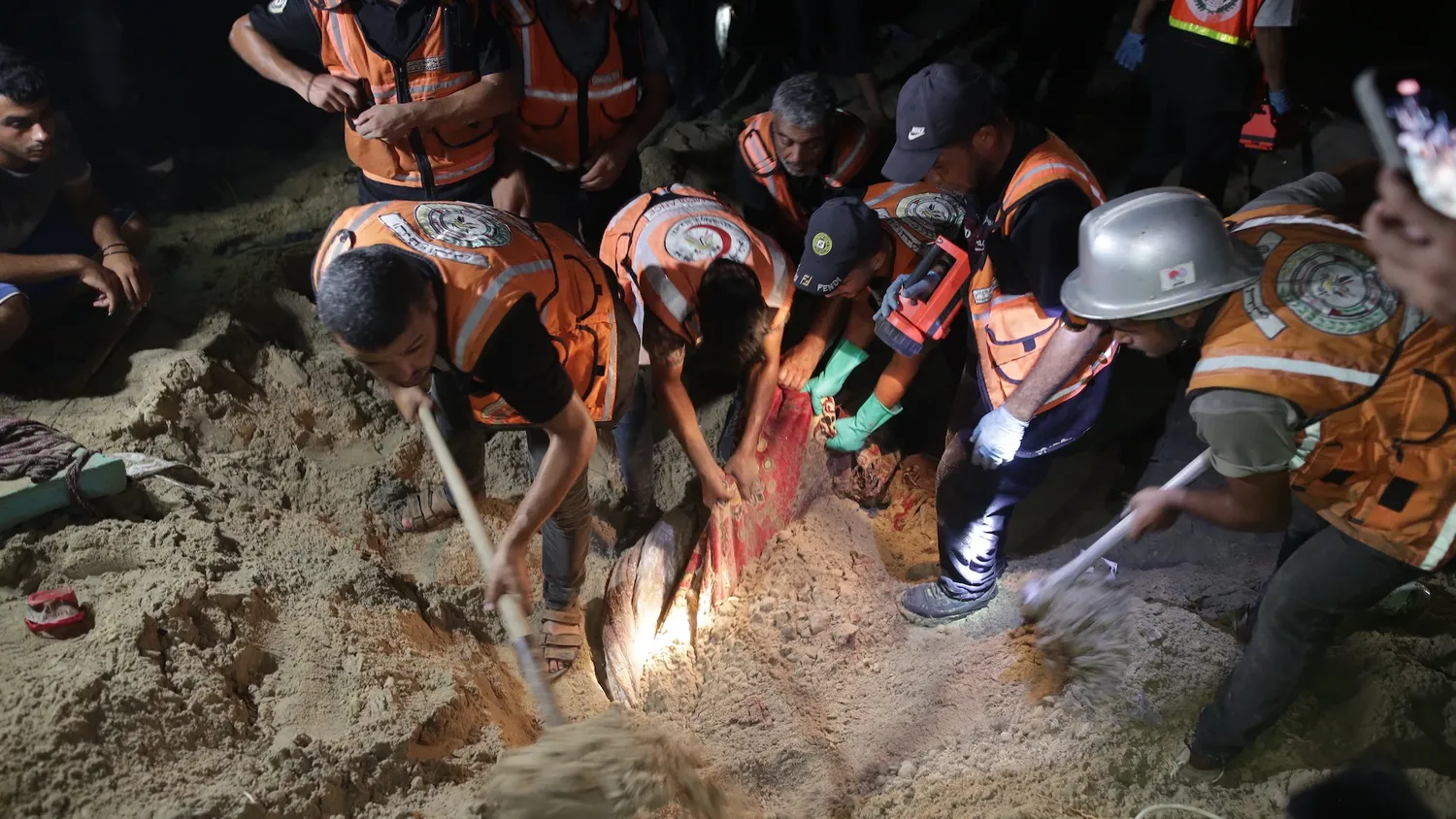 Teams conduct a search and rescue operation after Israeli airstrike on a tent encampment of displaced Palestinians in Al-Mawasi area of Khan Yunis, Gaza on September 10, 2024