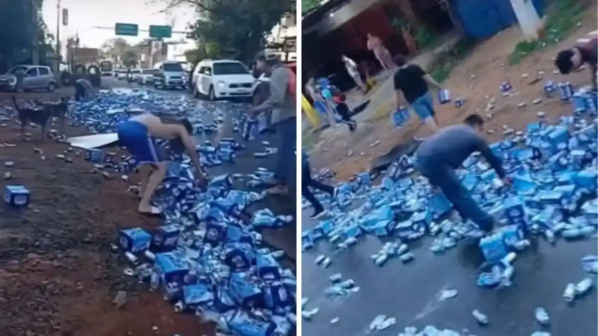 Vecinos aprovecharon el accidente para llevarse las latas de cerveza caídas del camión.