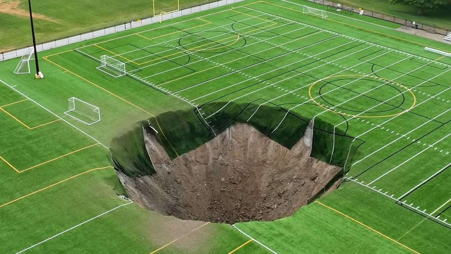 A sinkhole on a soccer field in Alton, Illinois, on 27 June 2024