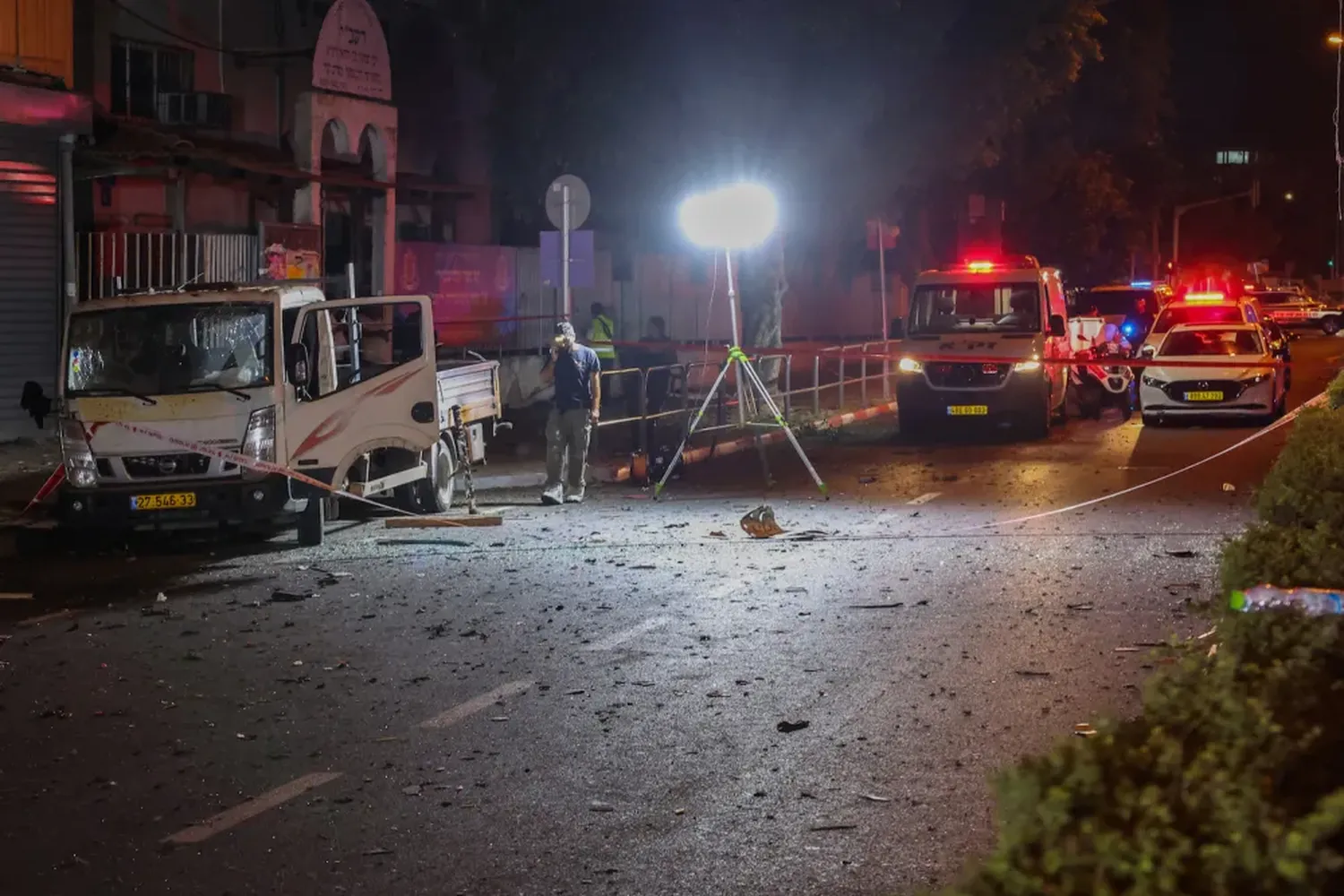 Israeli security and emergency personnel cordon off the site of an explosion in Tel Aviv, Israel, on Aug. 18.