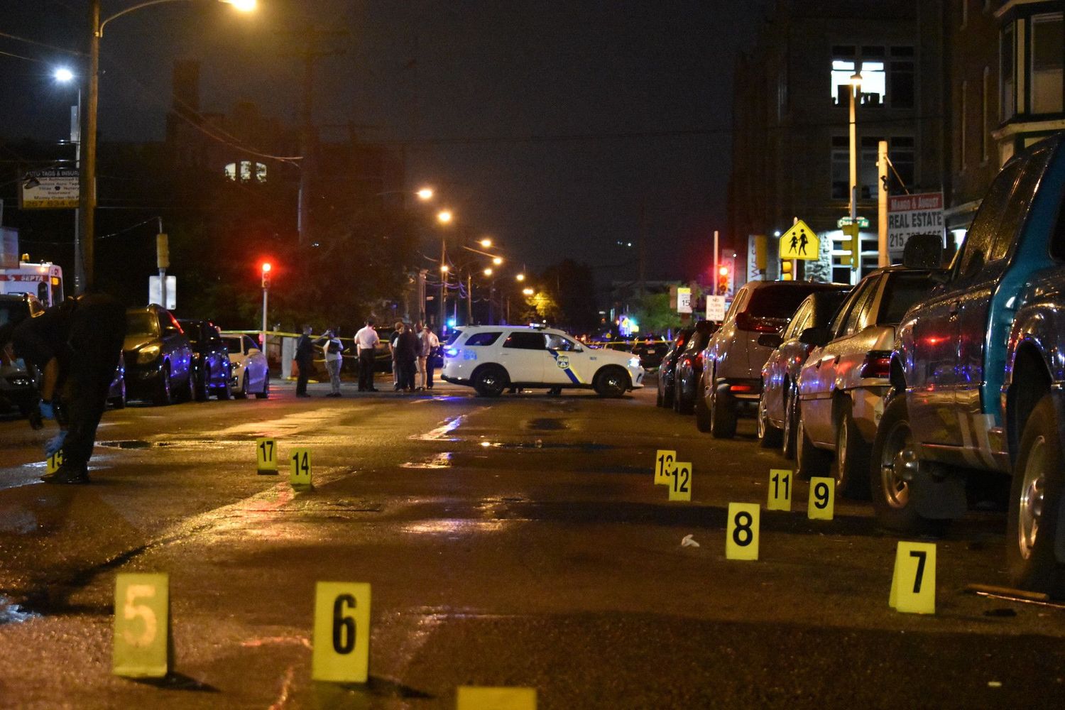 A police officer pictured at the scene of a shooting in Akron, Ohio on Sunday. Police say one person is dead and two dozen are injured