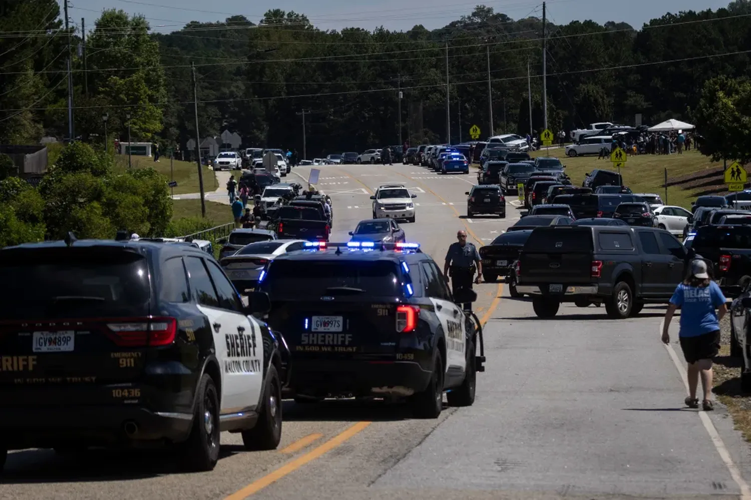 Law enforcement and first responders are seen at the scene following a shooting at Apalachee High School in Winder, Georgia, on Wednesday.