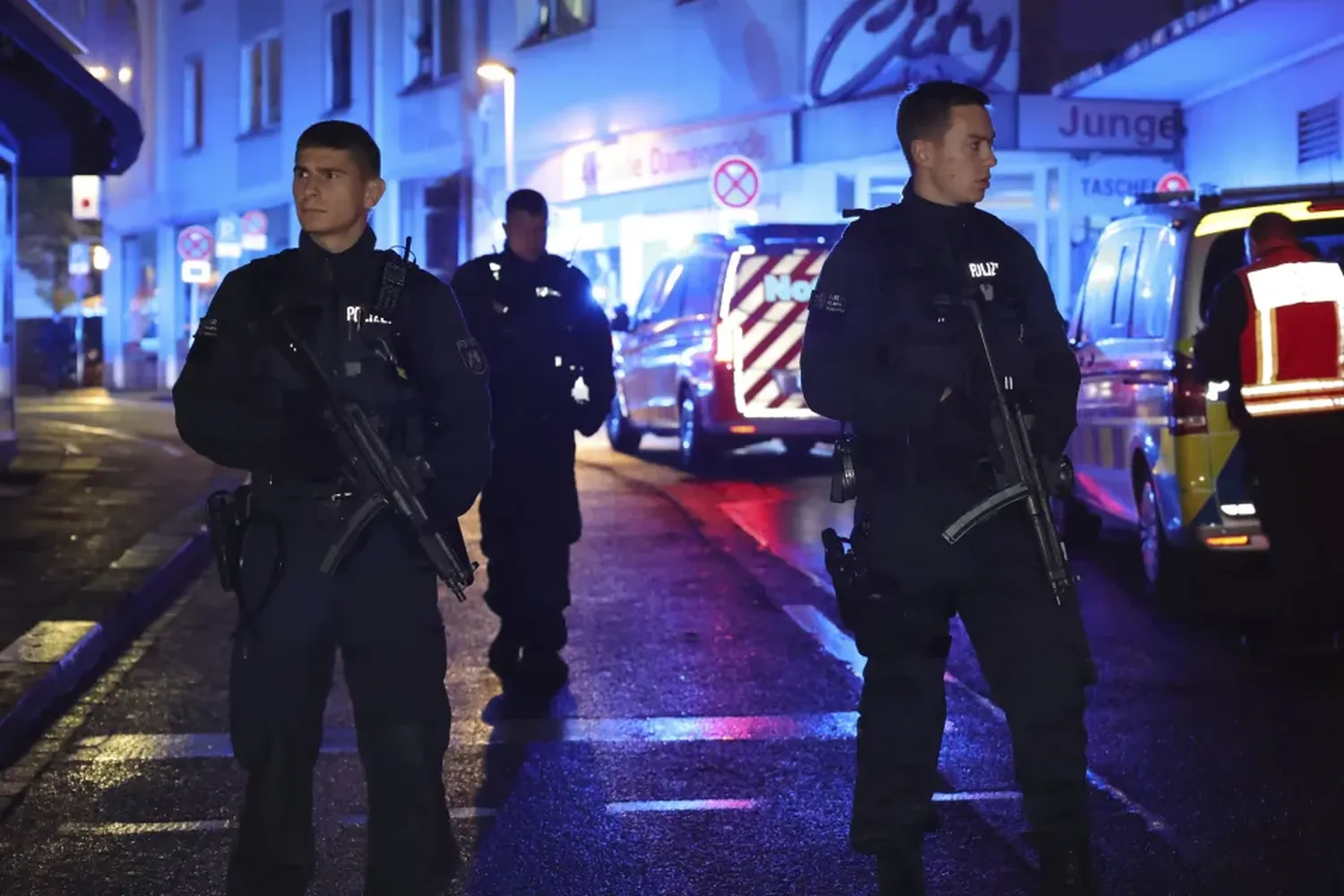 Police and ambulances near the scene where people were killed and injured in an attack at a festival in Solingen