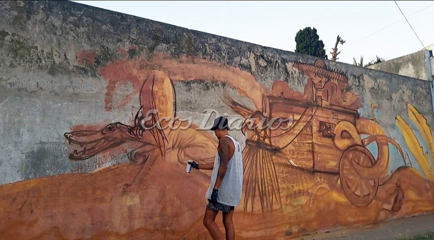 Pintando. El artista y su obra plasmada en la calle 48 entre 59 y 61