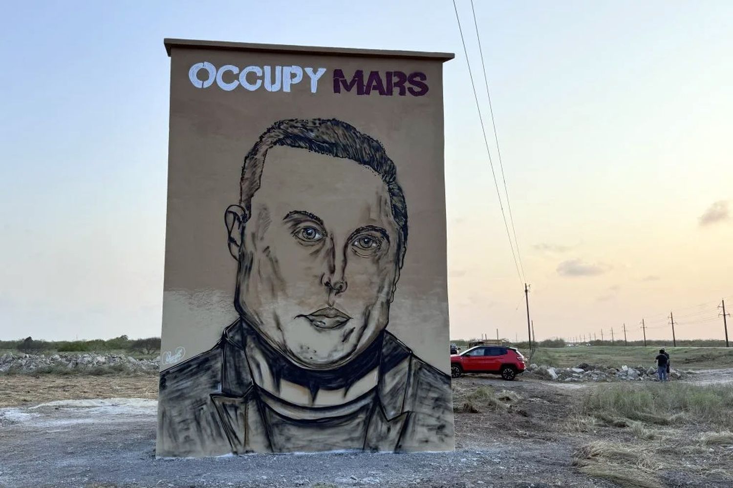 Un mural sobre la carretera con la cara de Elon Musk. Foto: EFE | Octavio Guzmán.